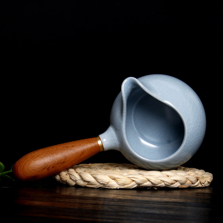 The picture of the fairness cup of Ru Kiln. Its glaze color is the classic sky-blue, just like the sky after the rain stops and the sky clears, being gentle and soft, giving people a sense of tranquility and elegance. The body of the cup is covered with fine crackle patterns that are naturally intertwined and as light as cicada wings. This is the unique artistic feature of Ru Kiln porcelain, demonstrating the superb level of the firing technique of Ru porcelain. 