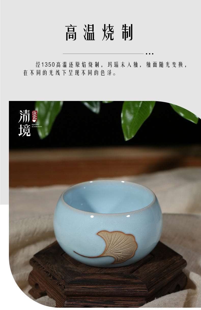 A Ru porcelain tea cup with sky-blue glaze. The body of the cup is in an elegant cylindrical shape with smooth lines. The whole cup is covered by the light and elegant sky-blue glaze, fully demonstrating a primitive and classic charm. 